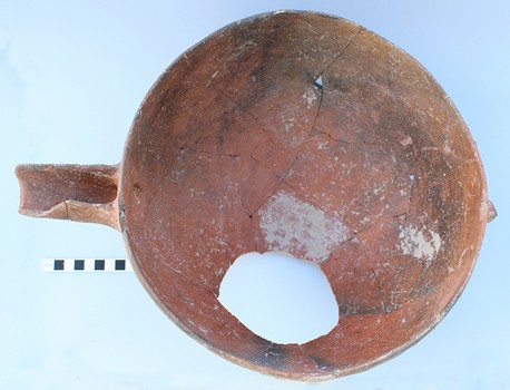 Figure 2: Red Polished IV spouted bowl (KS651). The bowl was smashed in place and a fragment deliberately removed during the Bronze Age. The handle was already missing when the bowl was deposited. Photo Source: Cyprus Department of Antiquities